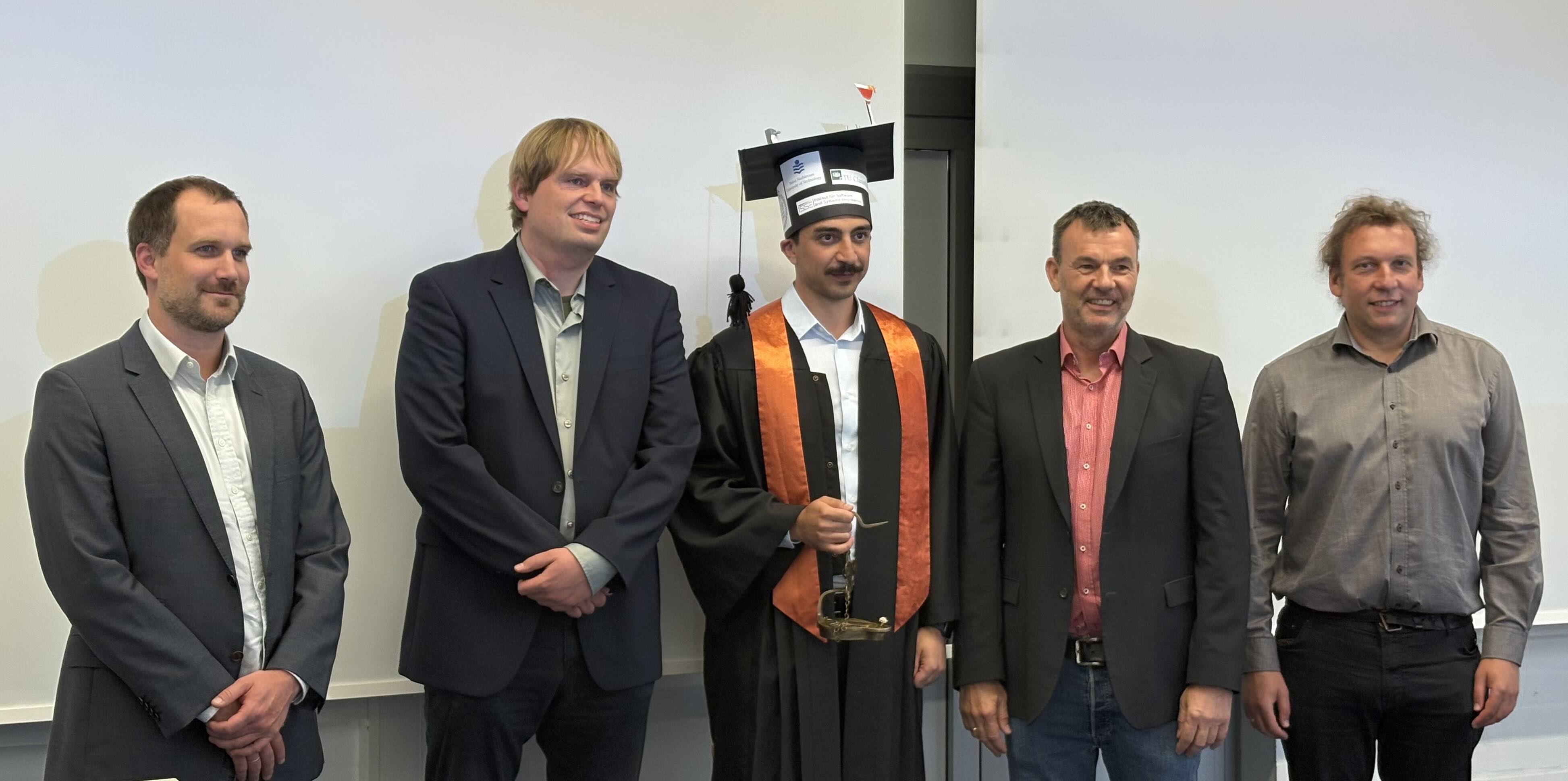PhD defense photo with coworkers and supervisors