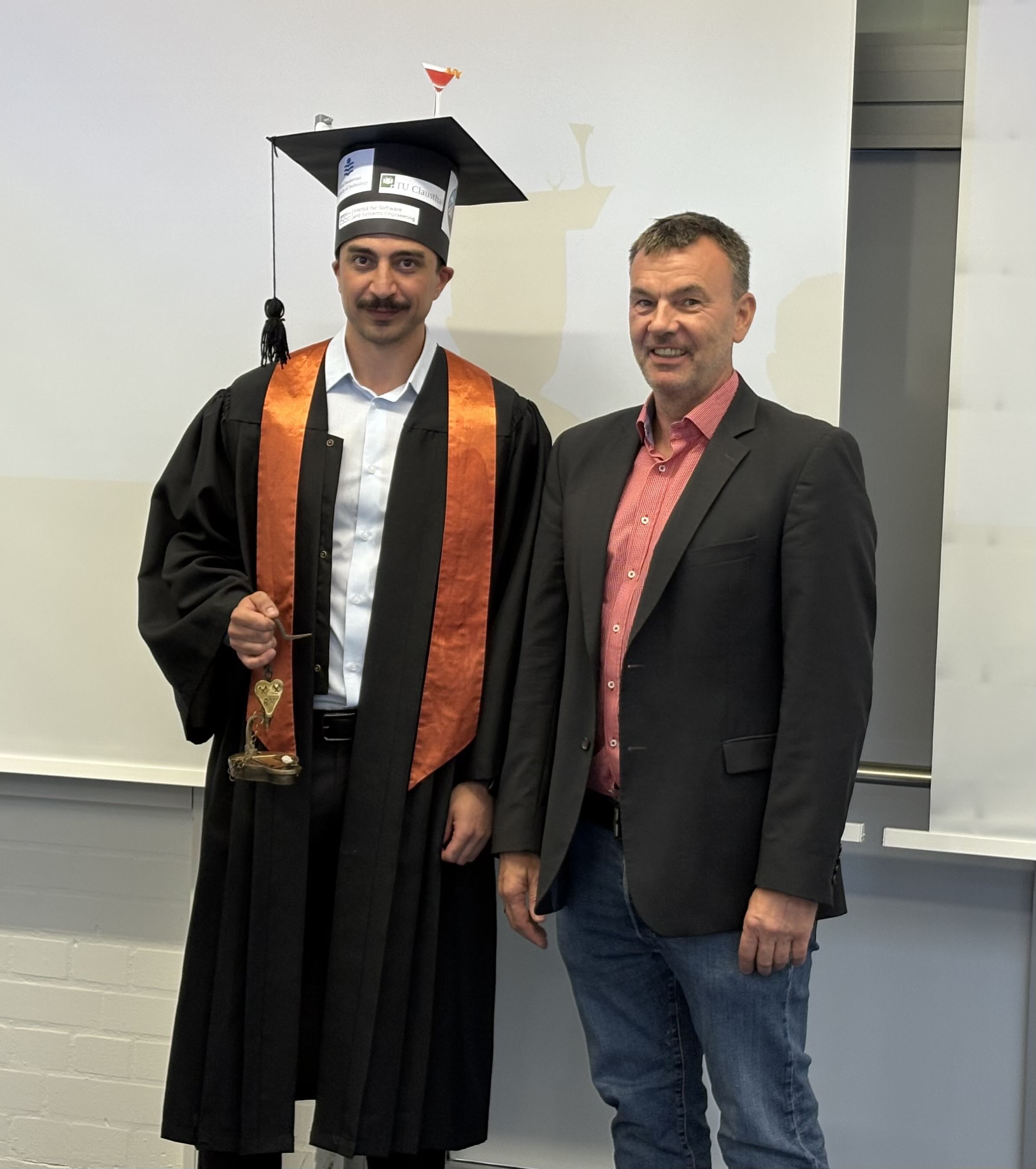 PhD defense photo with coworkers and supervisors