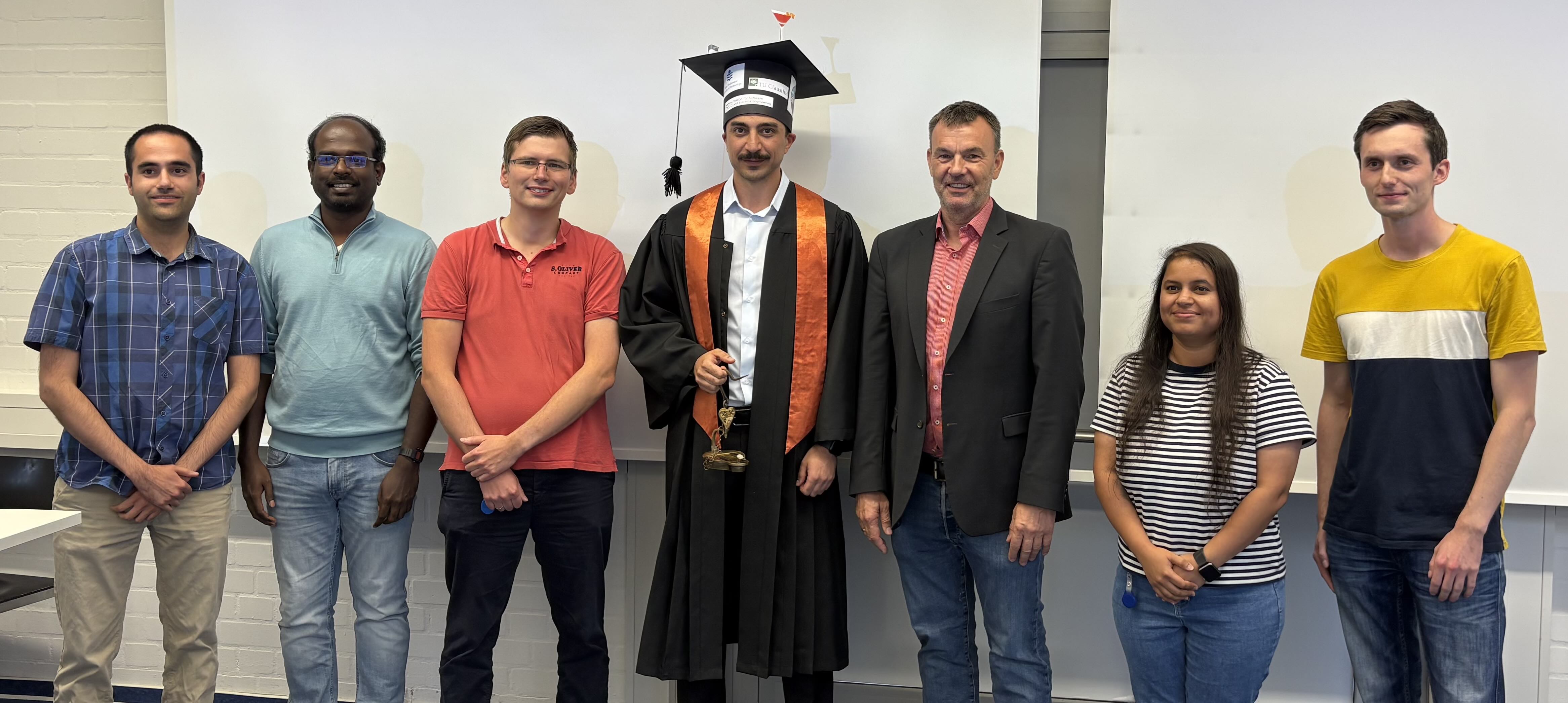 PhD defense photo with coworkers and supervisors